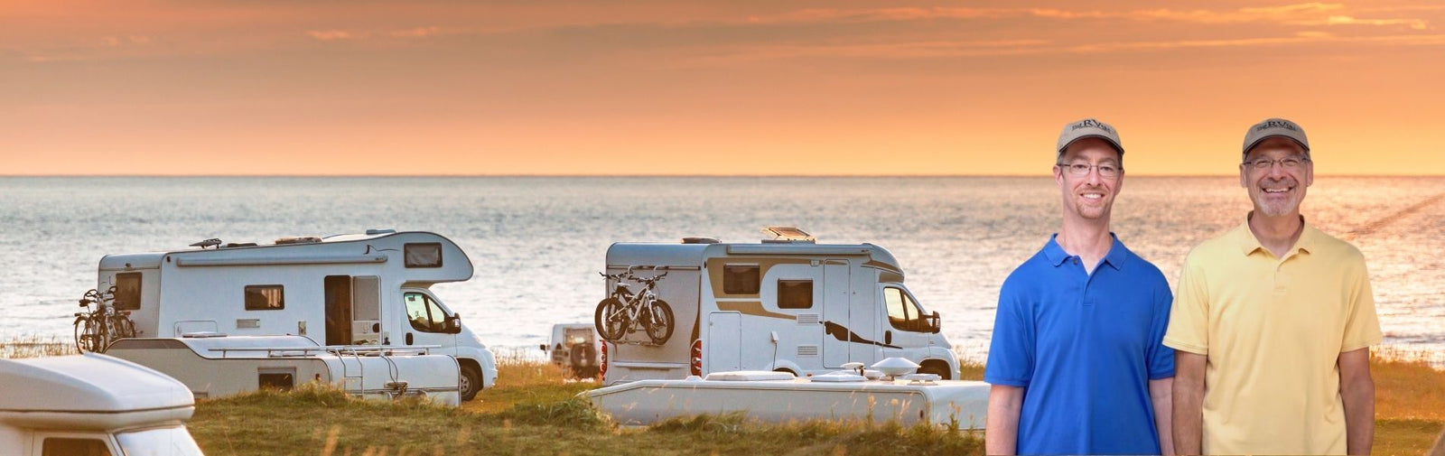 RVGeeks Standing in front of RVs by a beach. 